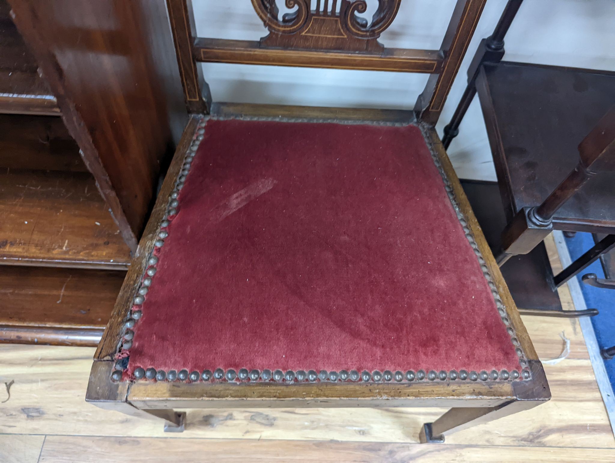 A pair of Edwardian inlaid mahogany lyre back chairs